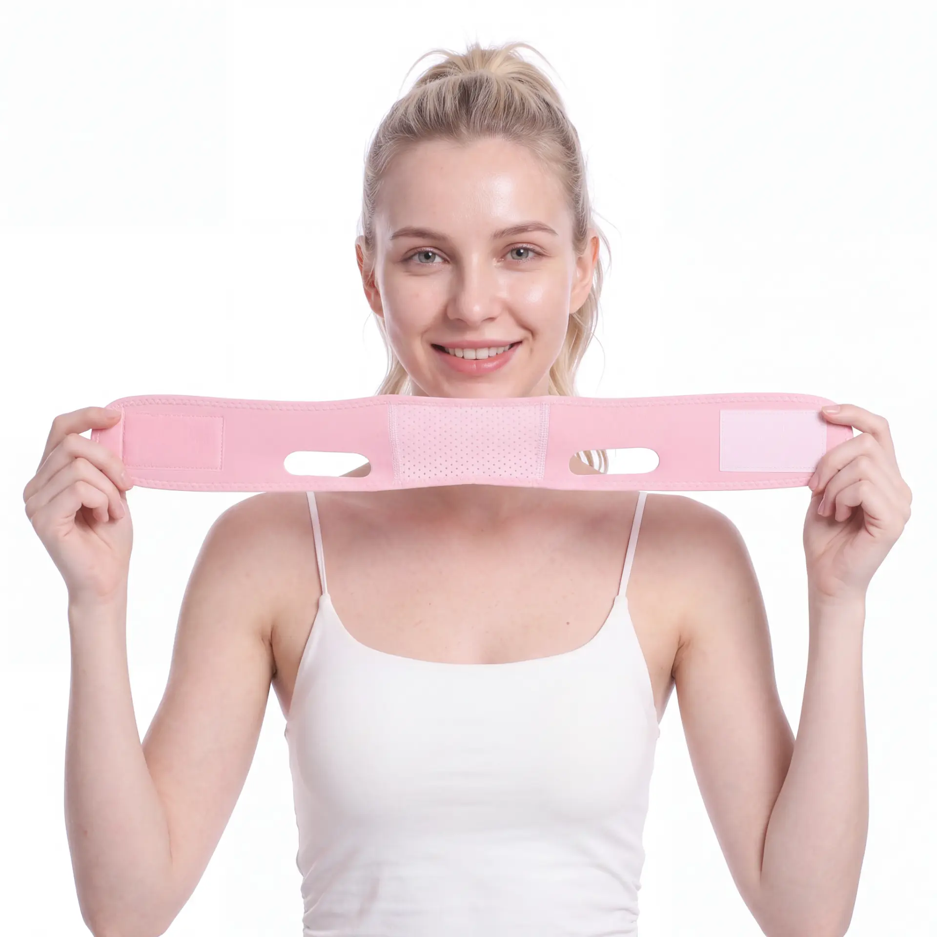 Holding the pink V-line sculpting strap stretched out to show the fit