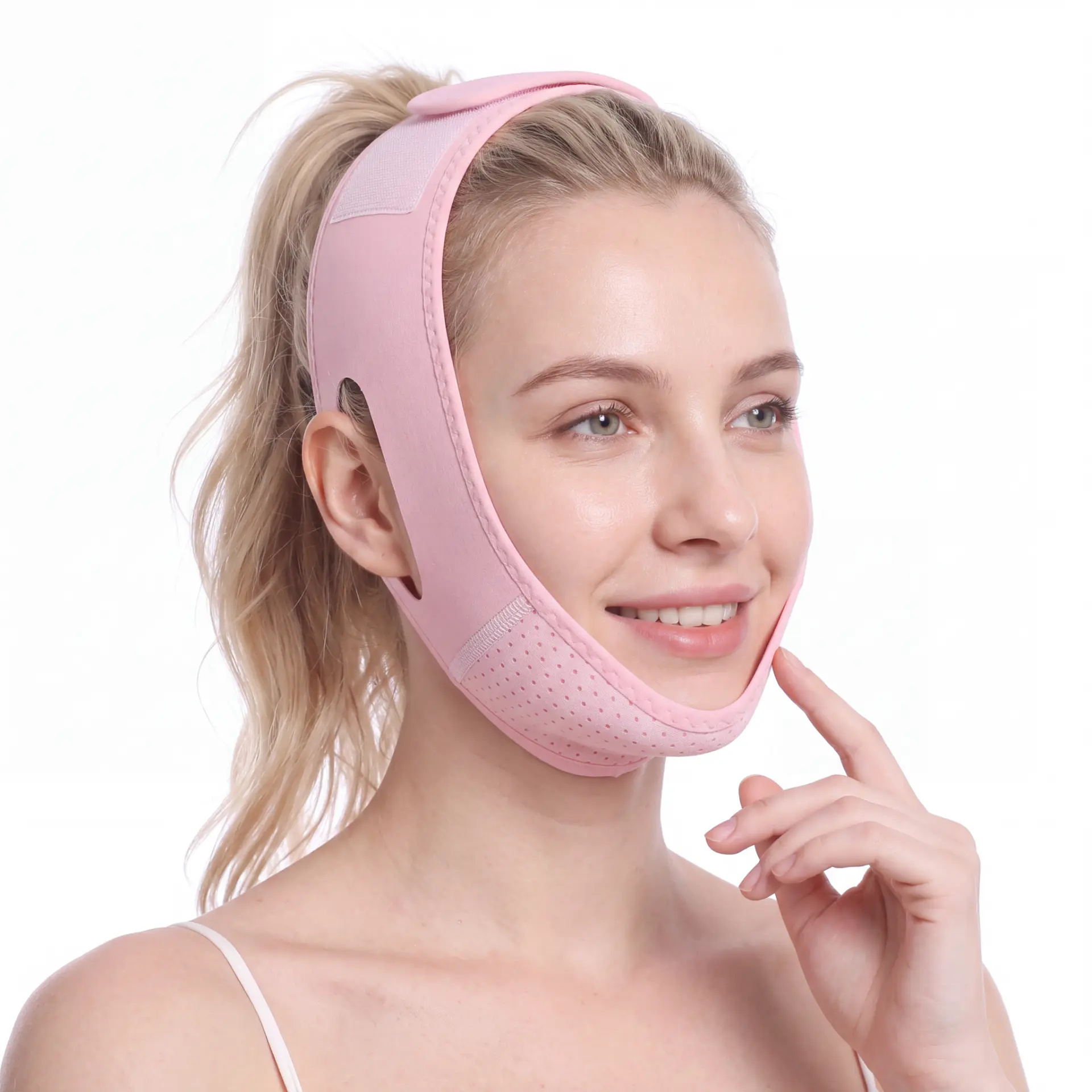 Woman smiling with the sculpting strap fitted under her chin